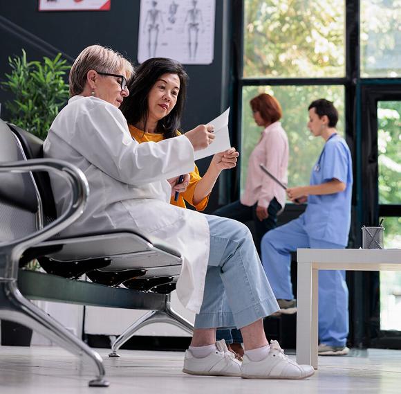 waiting area at hospital with dr talking with patient